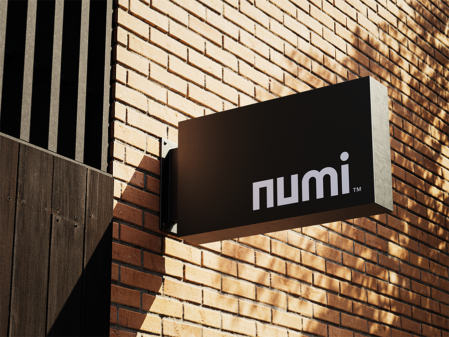 Numi logo displayed on shop front sign